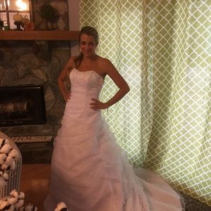 New, tags still on, size 6 wedding dress. Bra/slip included. $750 value for $300